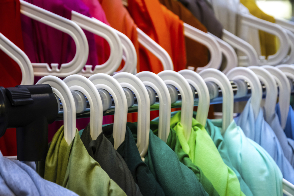 Colorful clothes on hangers