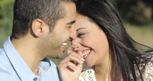 Arab casual couple flirting laughing happy in a park