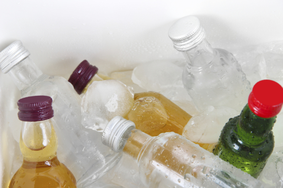 Minibar bottles with ice cubes, close-up