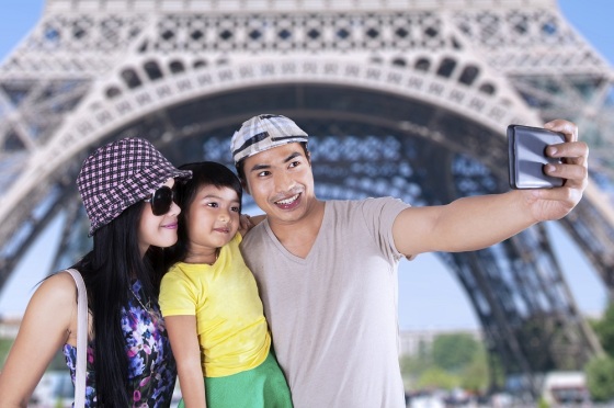 Tourist taking picture in eiffel tower