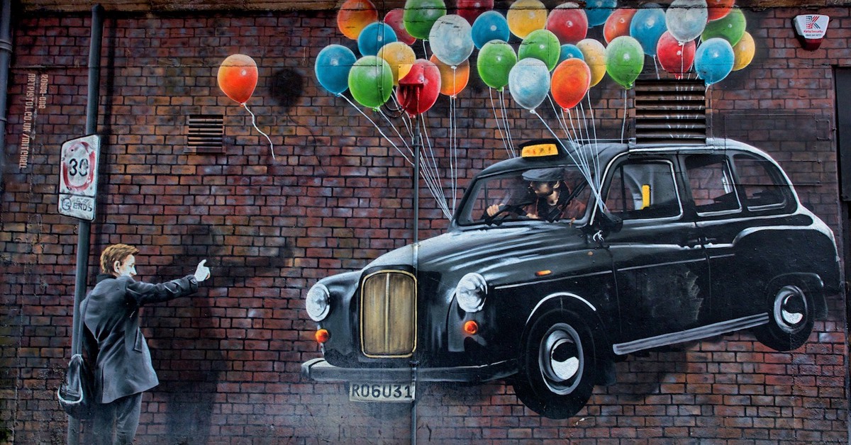 Graffiti de taxi con globos